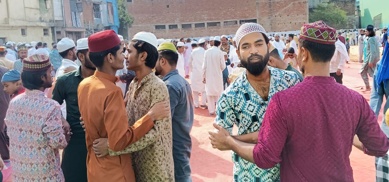 Heads bowed in prayer, greetings for Bakrid were given with hugs.