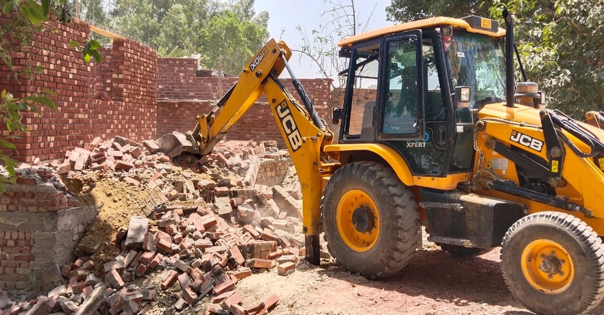 Bulldozer runs on illegally built madrasa in Kadrabad