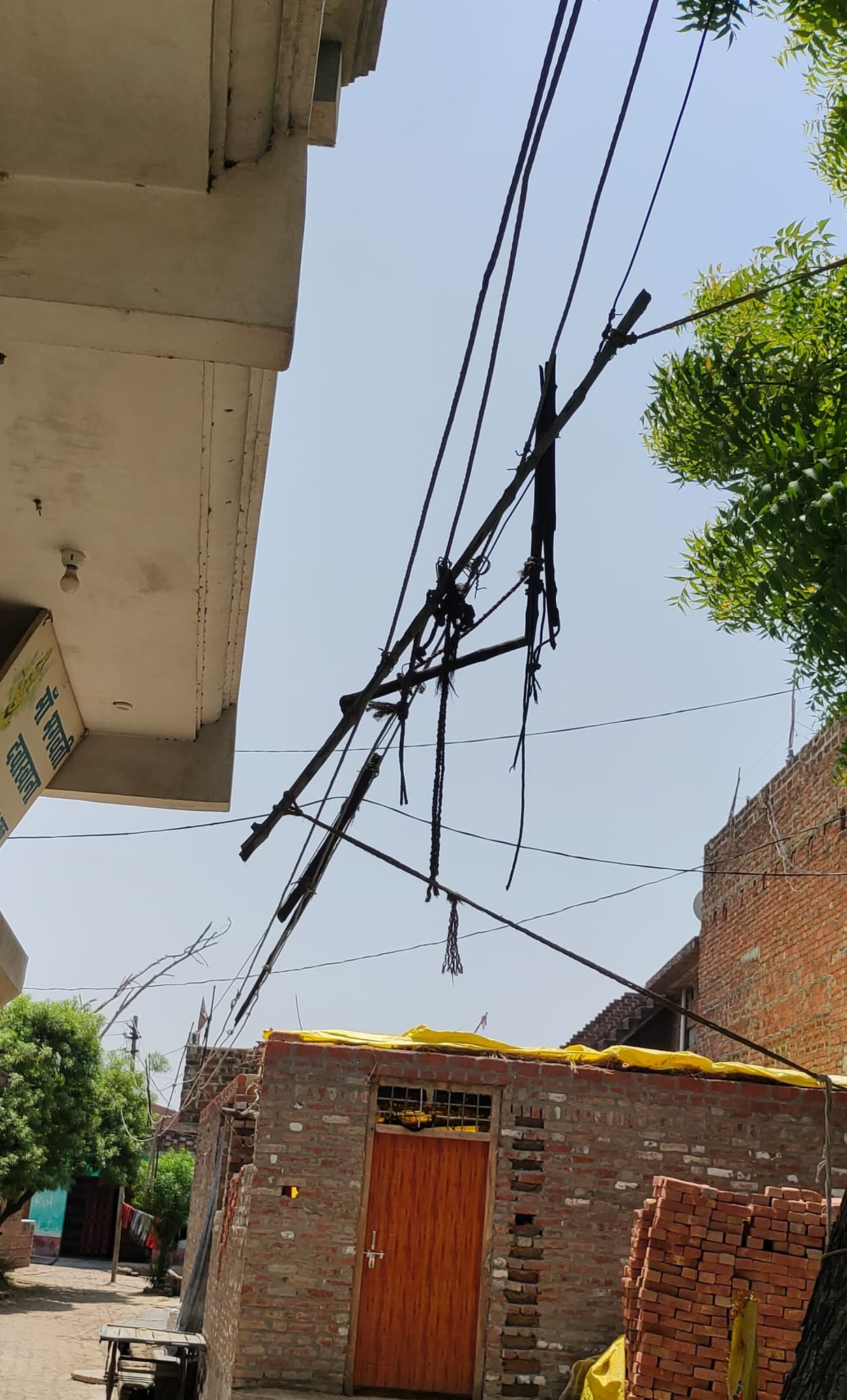 Fragile wires hanging over houses, poles damaged