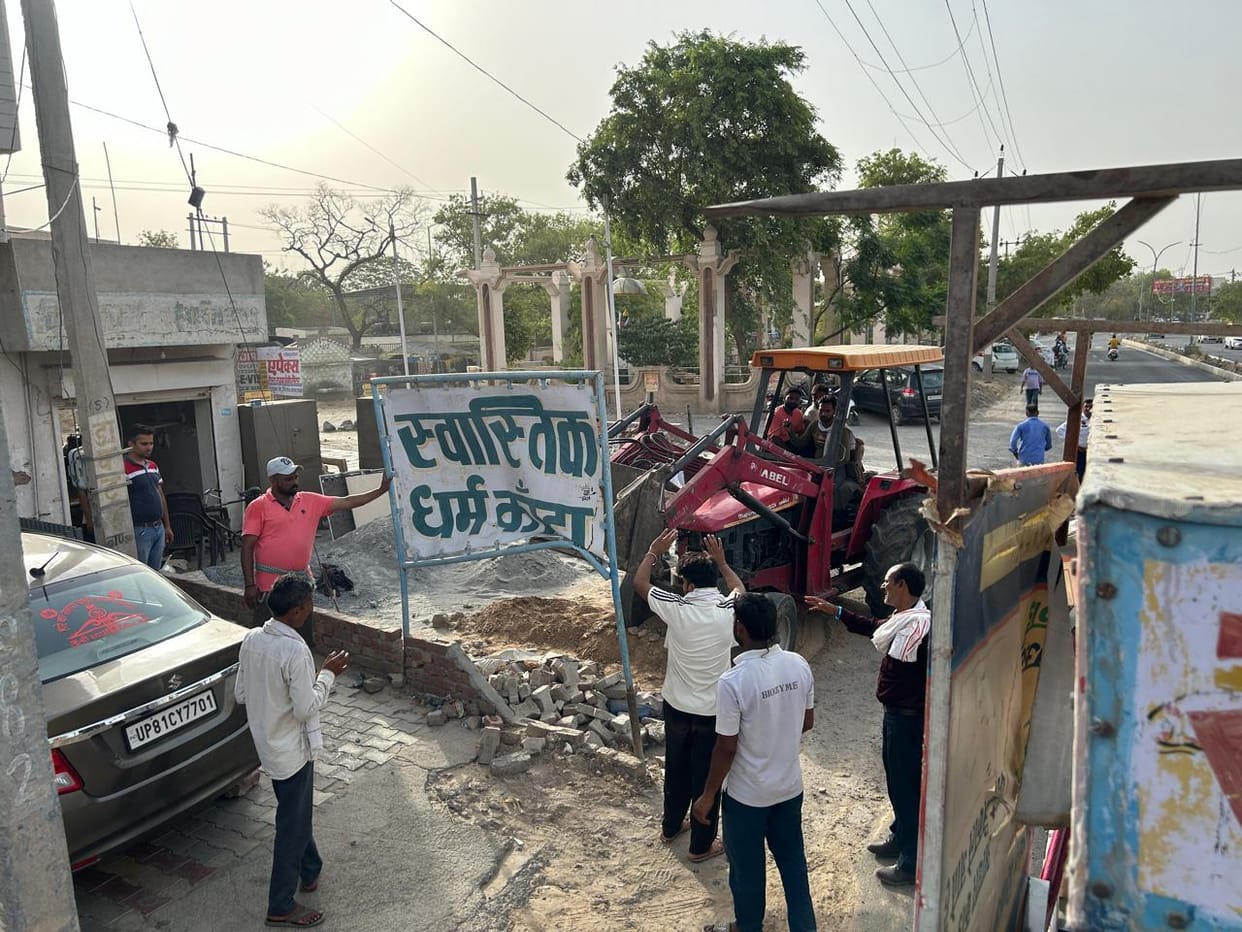 Uprooted pillars for parking on footpath in markets, also removed permanent boards