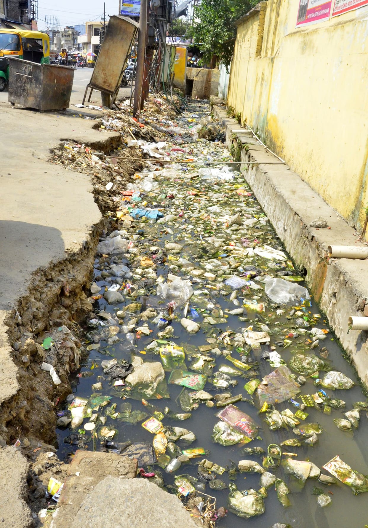 How are the city drains being cleaned without removing encroachments