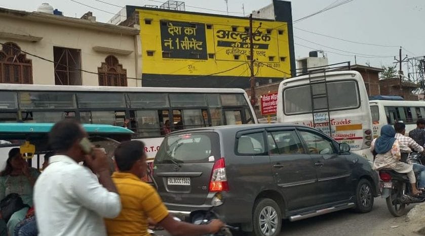 There is a daily jam due to buses and vehicles parked haphazardly