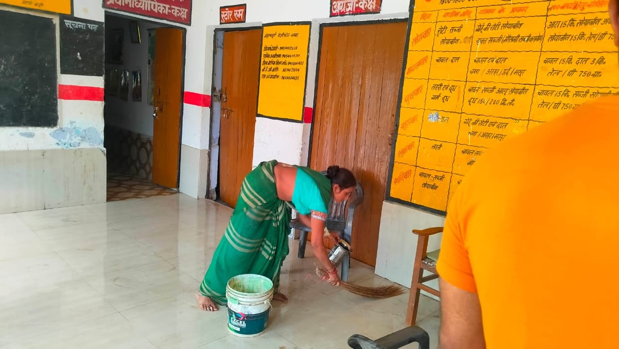 When the school opened, the teachers started cleaning
