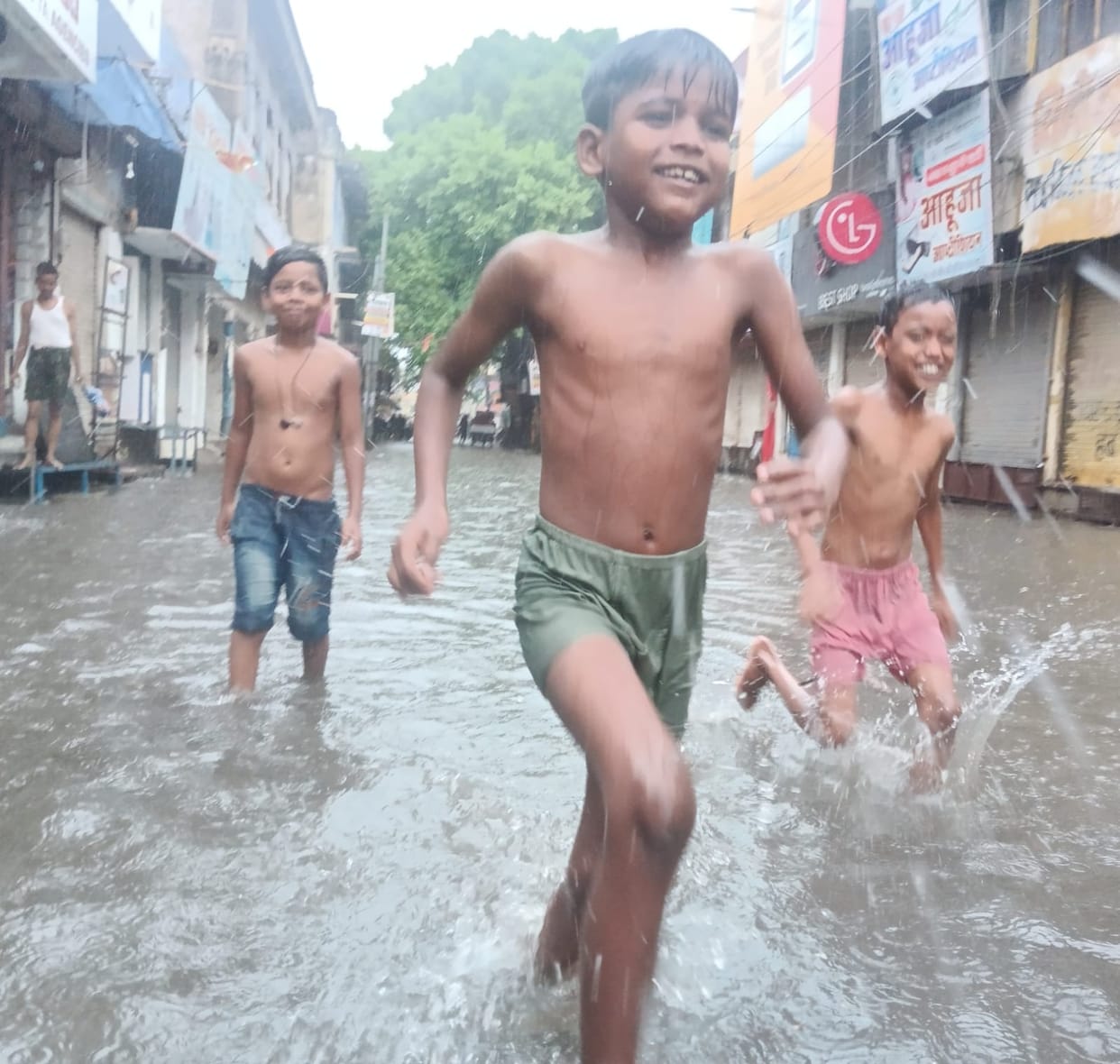 City roads submerged, tree clearing exposed