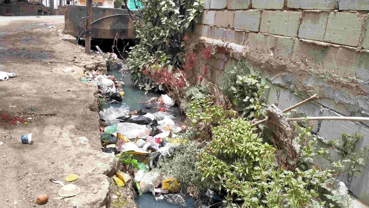 How will water come out of clogged drains?