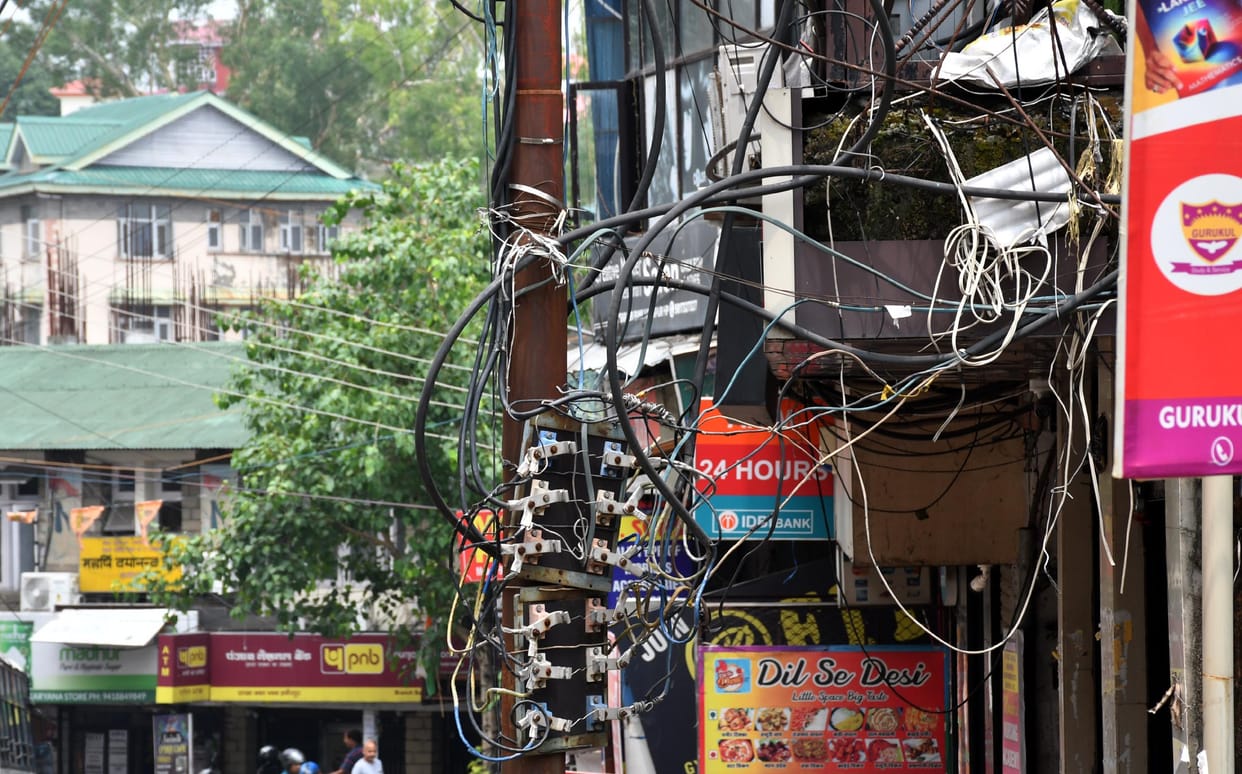 Electric wires are hanging at many places in the city, danger of accident