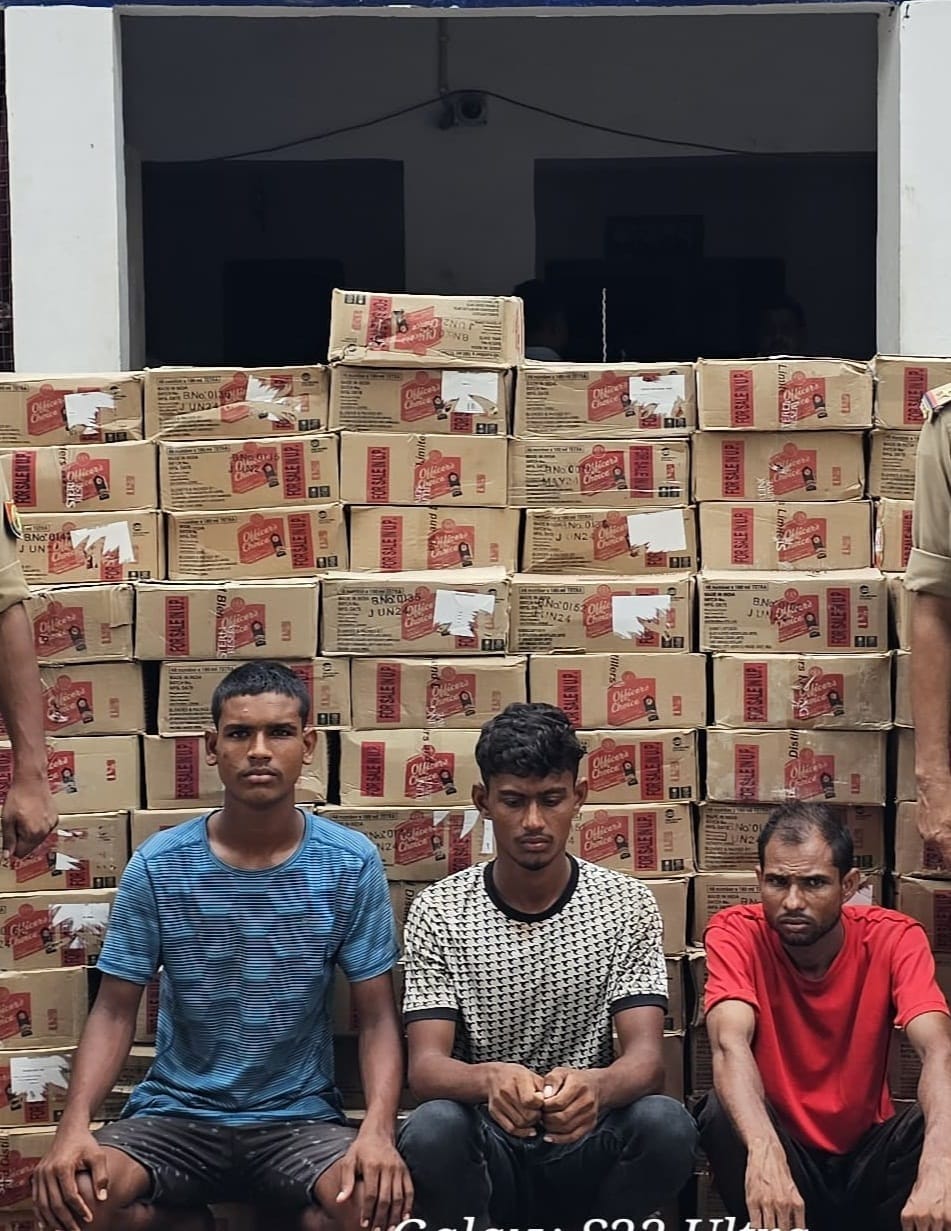 Three smugglers carrying liquor hidden under a brick in a tractor-trolley arrested.