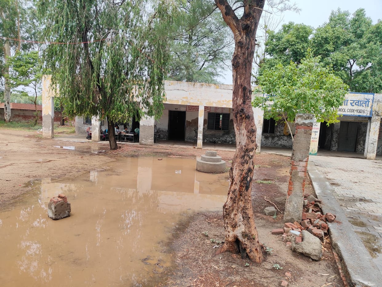 Students sitting in unsafe school building