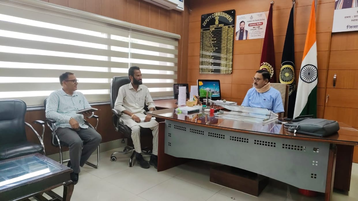 The Deputy Commissioner listened to the problems of the village sitting on the chair next to the Sarpanch.