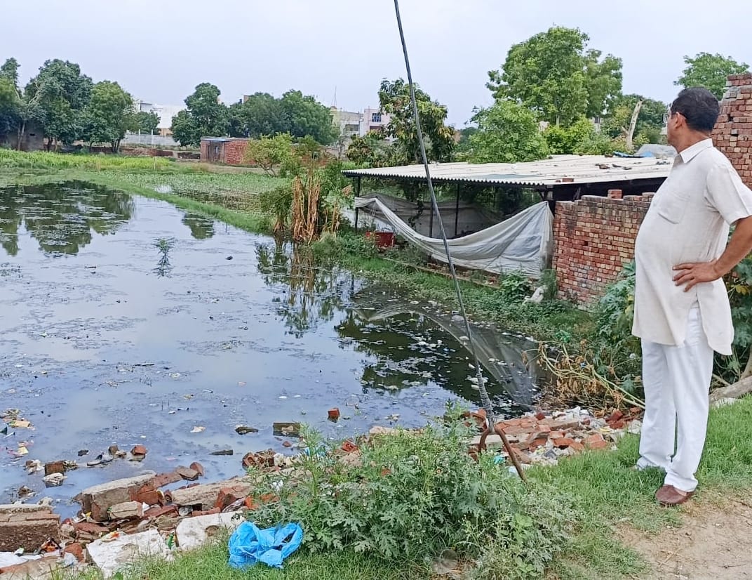 Fields filled with contaminated water due to broken drain, sorghum crop spoiled
