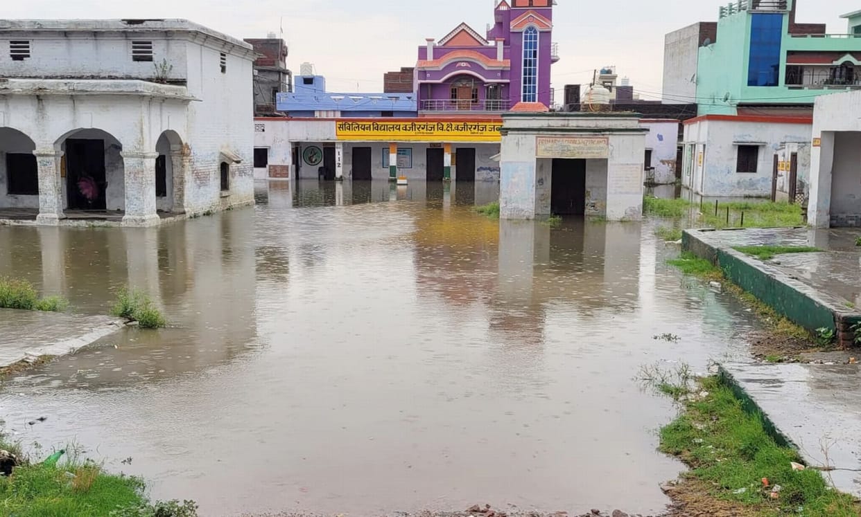 Hospital and school filled with rain water, classes held in temple