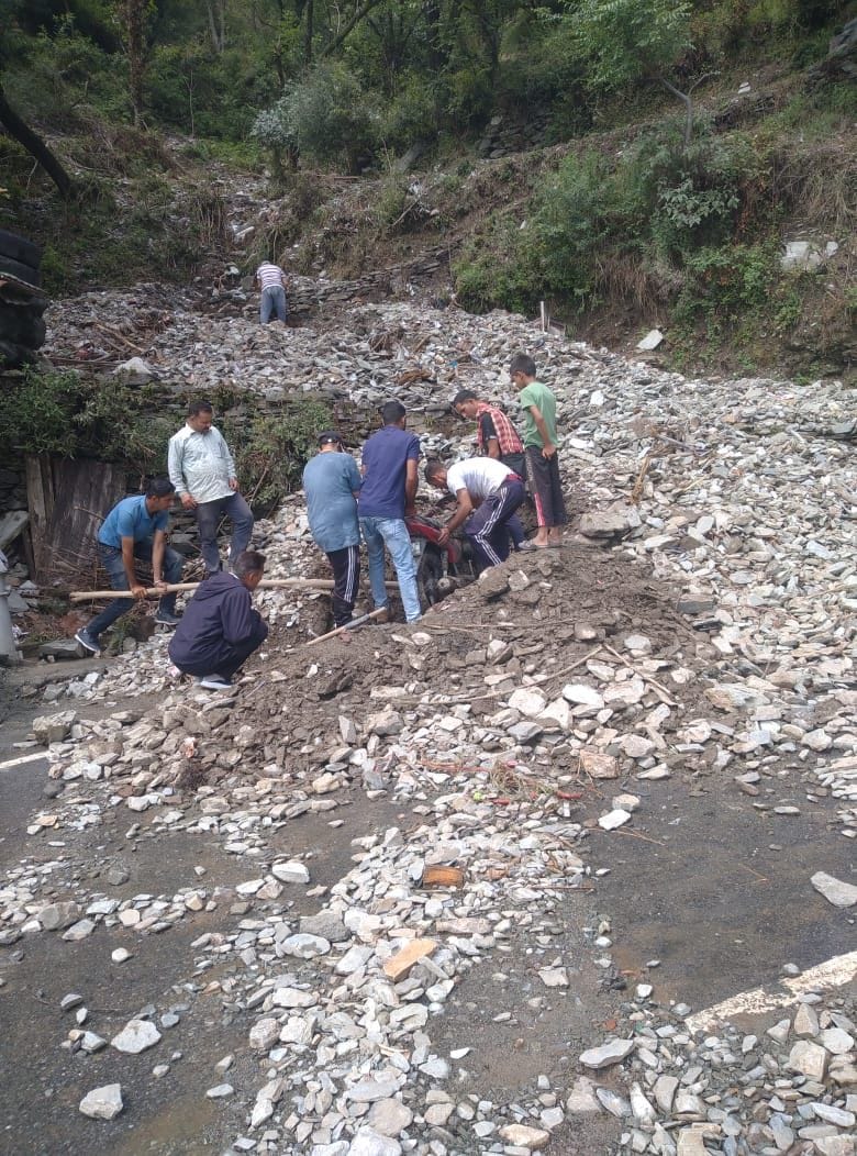 Vehicles buried under debris, shops and cowsheds filled with mud