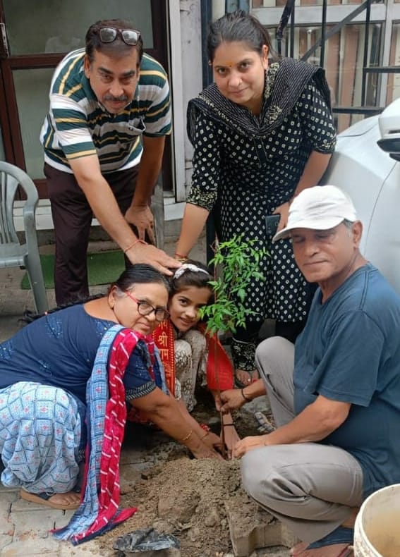 Girl Angel celebrated her birthday by planting a neem plant.