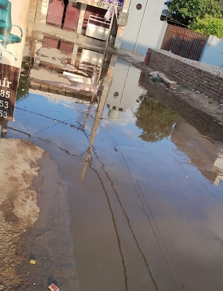 Piles of filth in Sheetal Nagar, Balaji temple street submerged