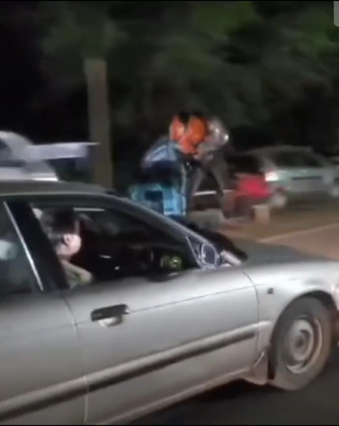Picture Goes Viral Of A Person Performing Stunt Wearing A Helmet On A Car Bonut