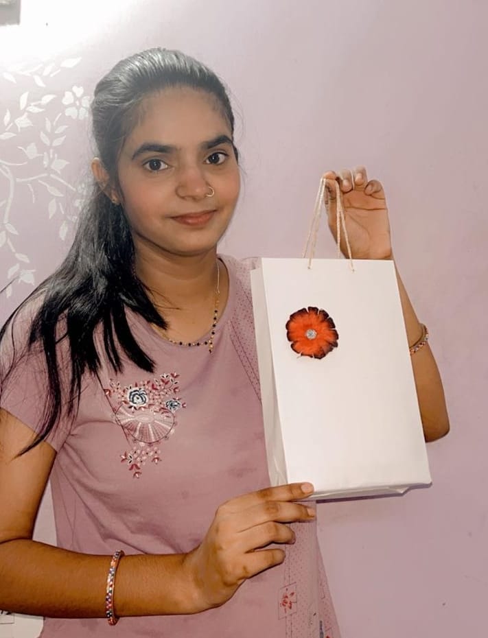 Volunteers gave the message of environmental protection by making paper bags