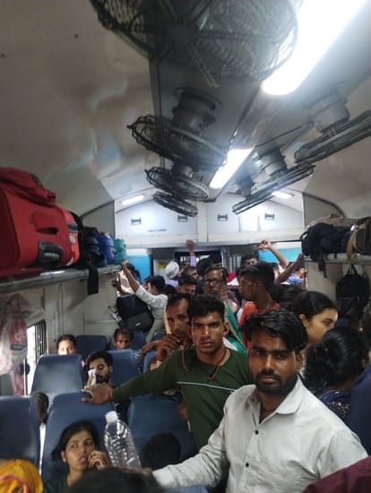 Trains are not crowded, passengers are lying even on luggage racks