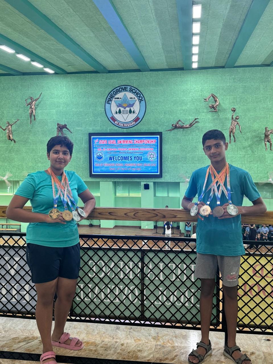 District swimmers dominate swimming competition, win nine medals