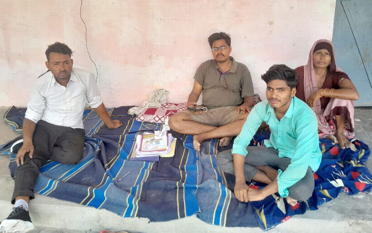 The son of a dismissed contract worker sits on a hunger strike