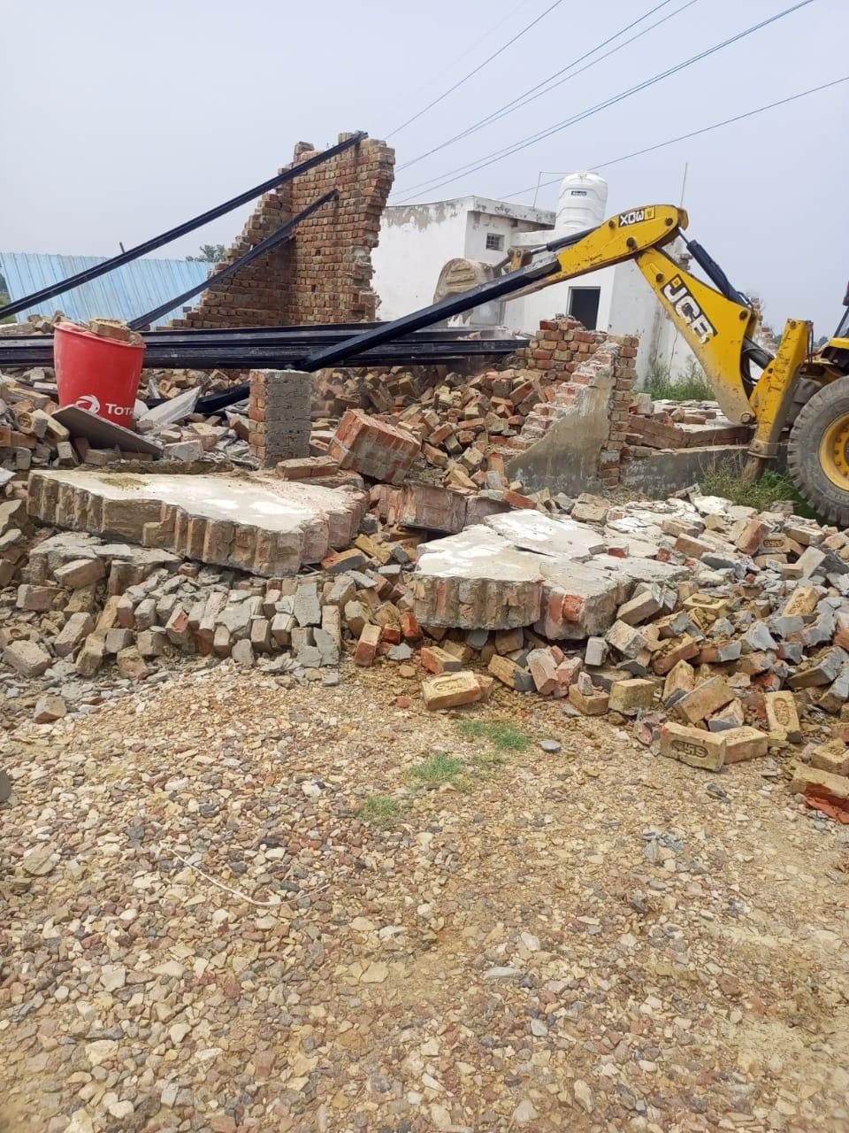 Illegal construction demolished with bulldozer