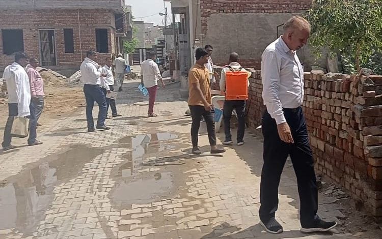 Health department team is going door to door to make people aware about malaria prevention