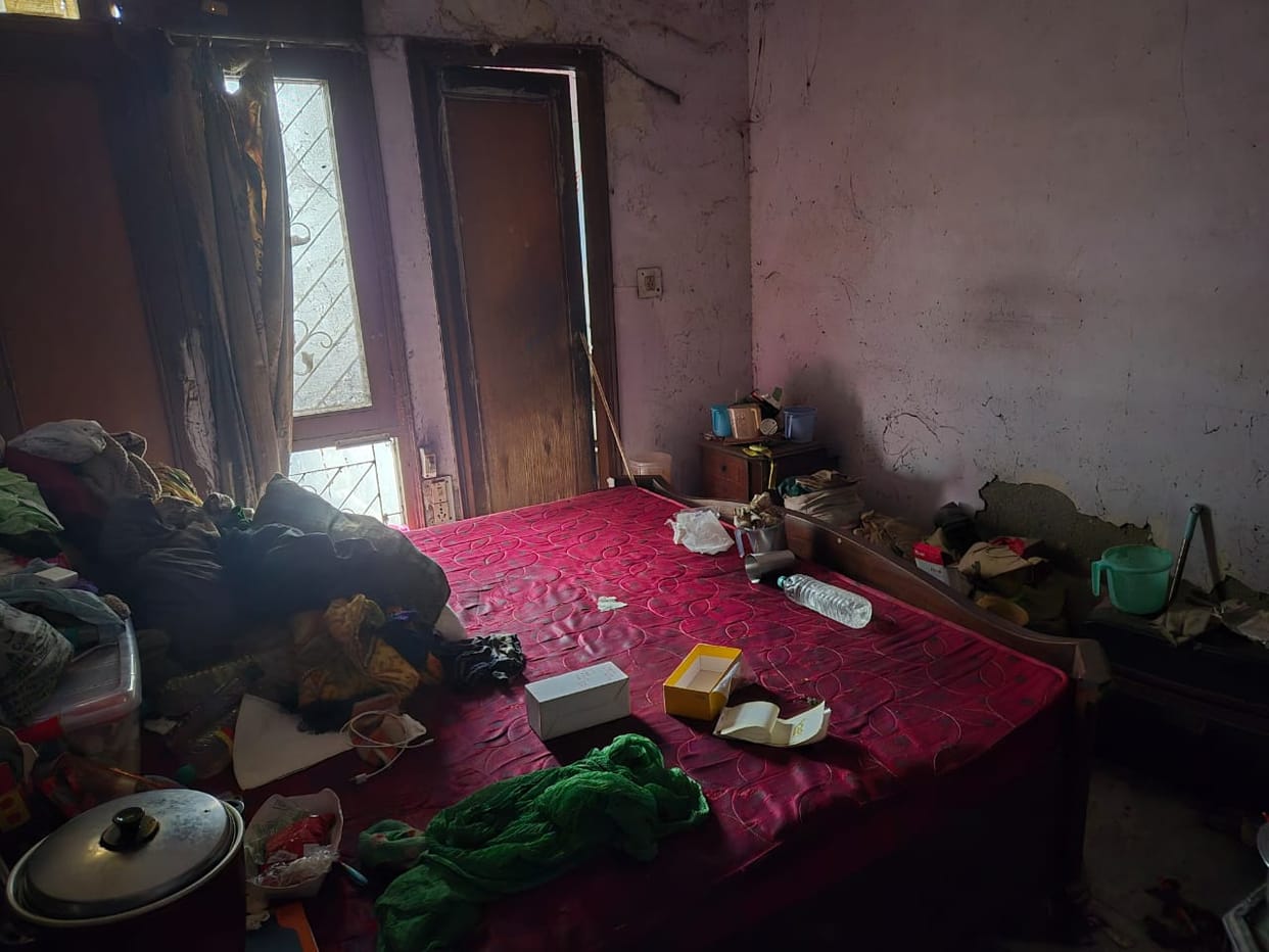 Dead body was rotting in dirt in a closed room 
Mother and sister thought brother was alive