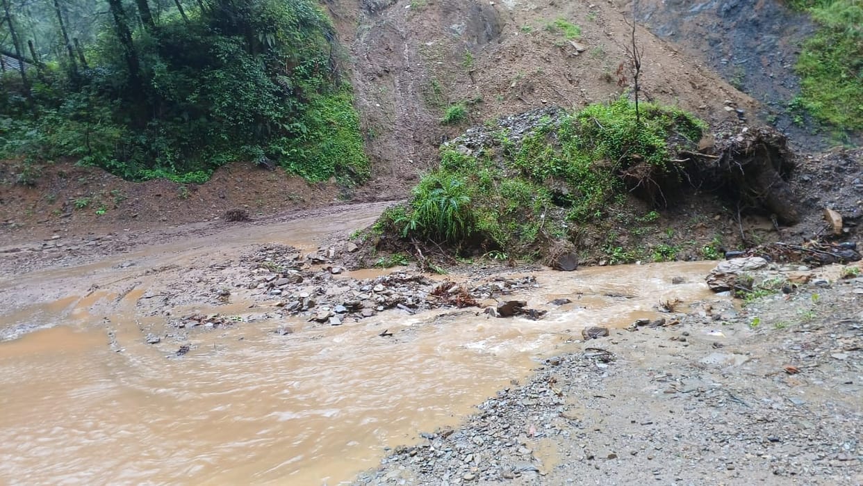 Drain flowing from the road without rain
