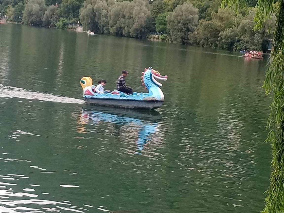 Challan for three tourists dancing while standing on the boat