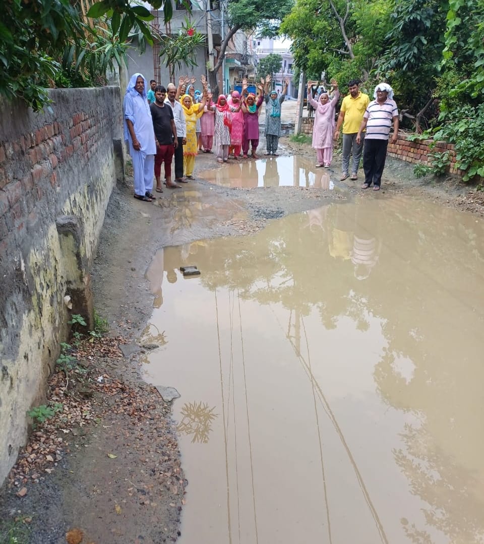 People protested against rain water filling in the street under construction