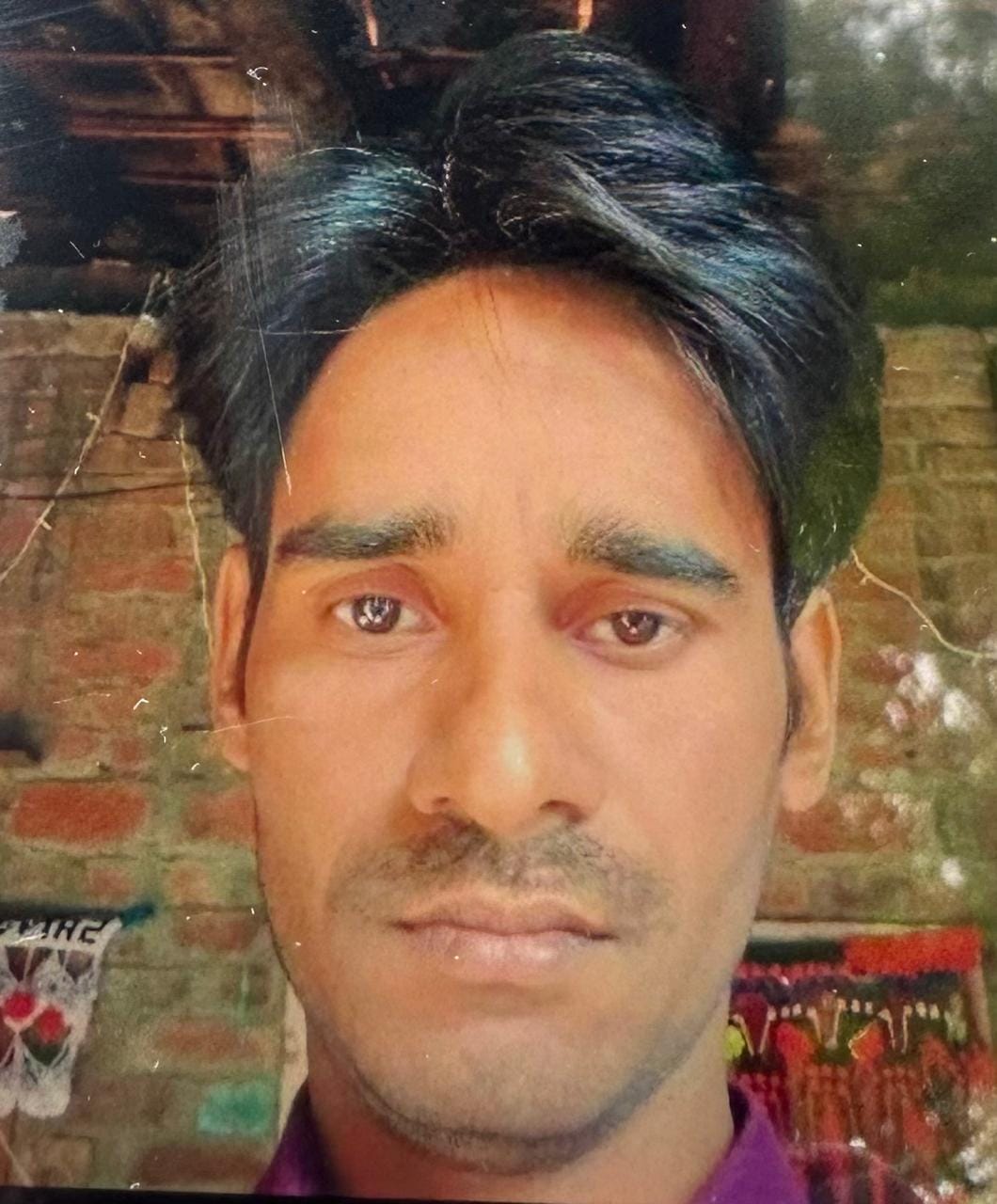 The body of a young man was found hanging in a room under suspicious circumstances