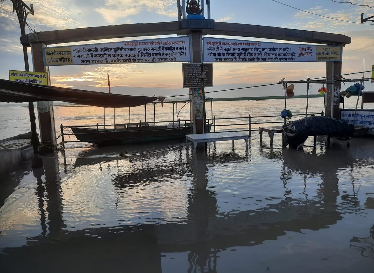 Ganga in spate, water flowing through fields towards population