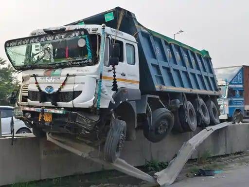 Trolley hanging from highway railing, major accident averted