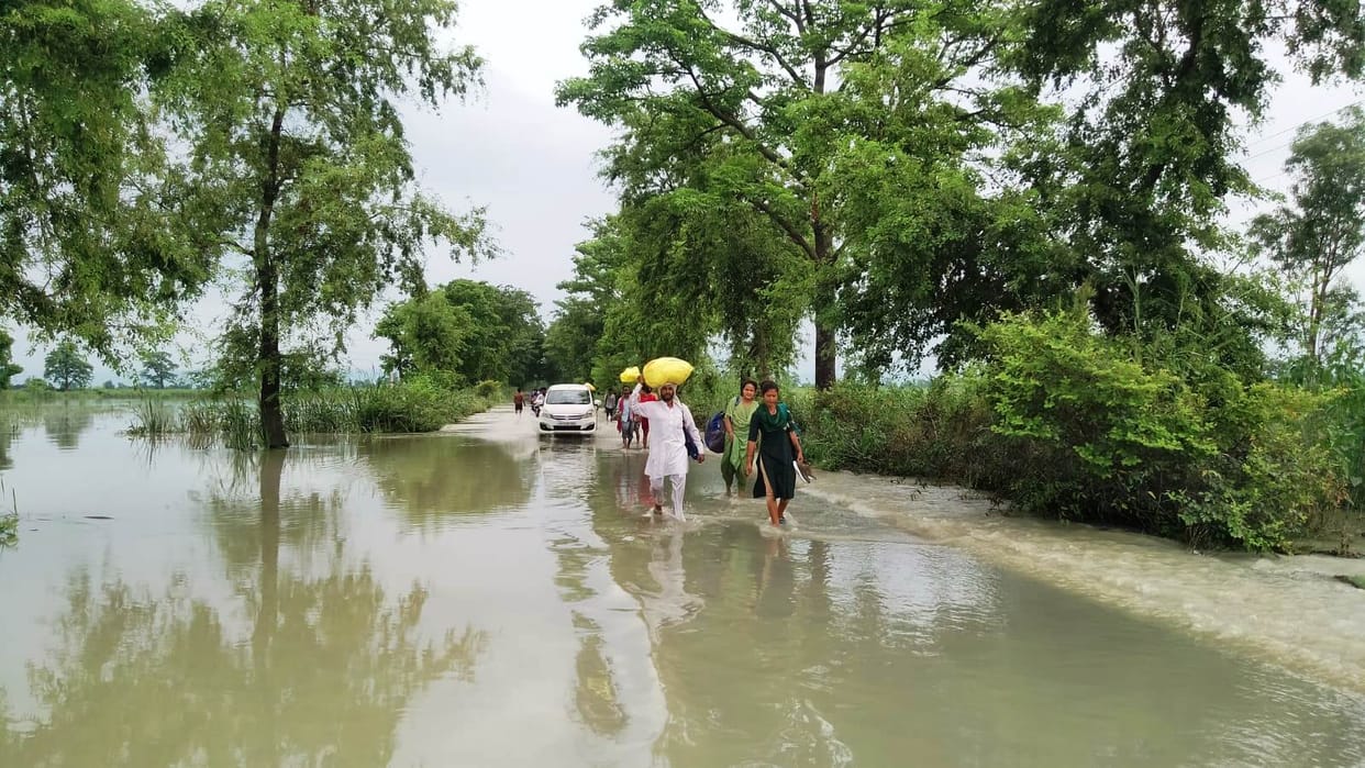 Due to increase in water level, water is flowing on the road again