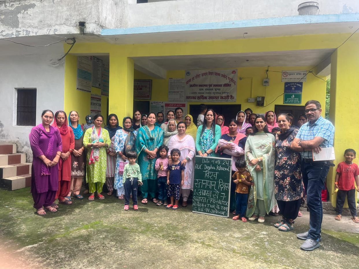 Explain the benefits of breastfeeding to women in Anganwadi centers Duggha and Mattansiddh.
