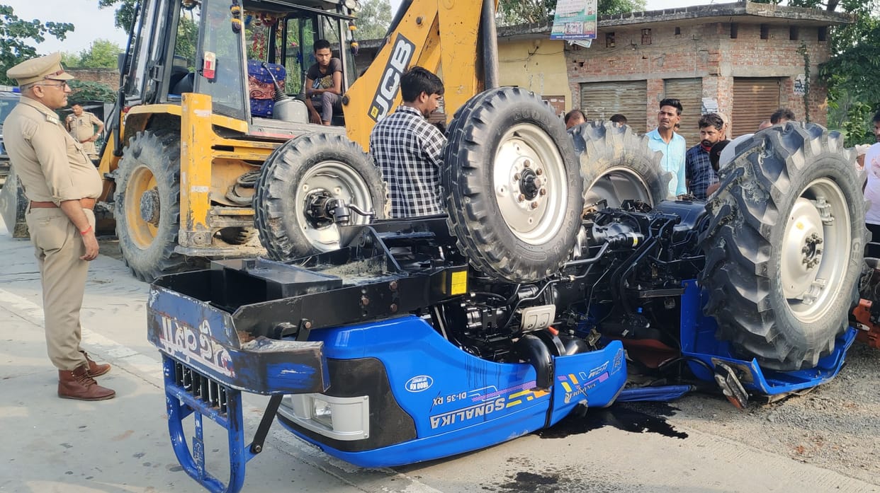 Tractor overturns due to collision with DCM, driver dies