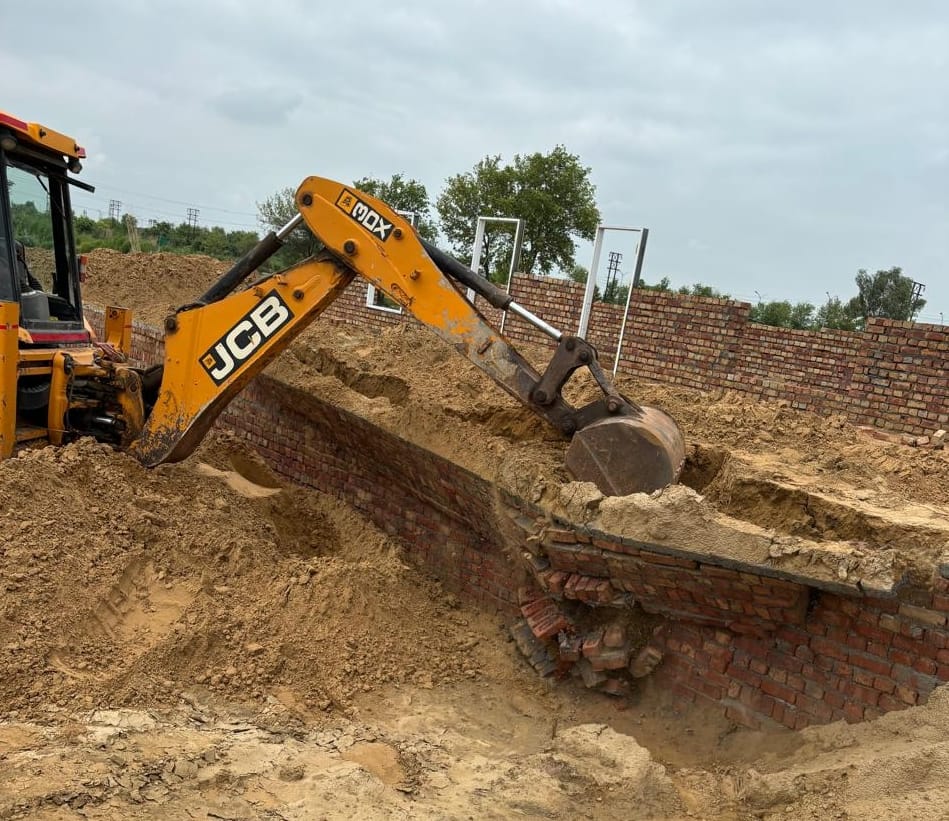 District city planner demolished illegal colony constructions