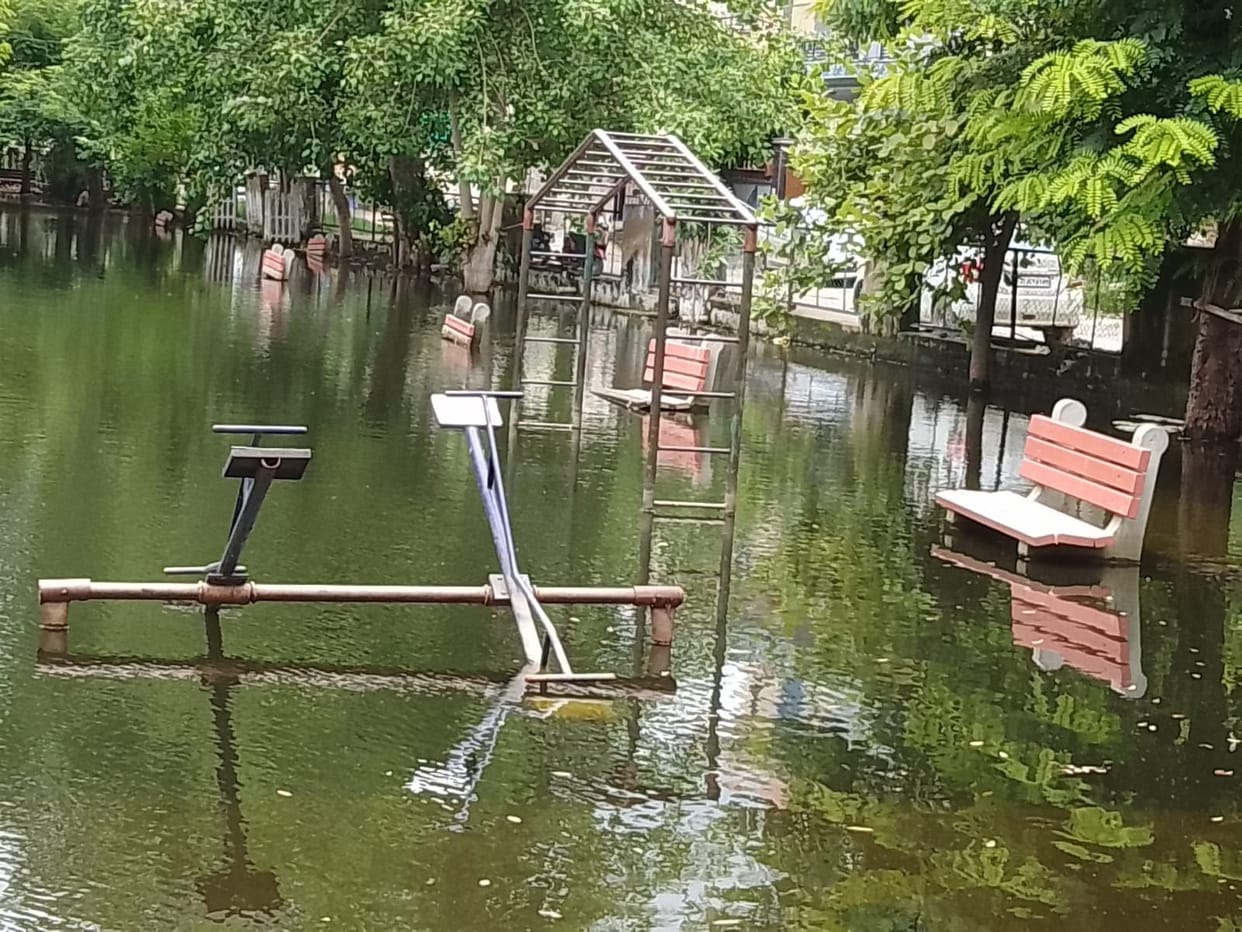 City parks filled with up to three feet of rain water, swings submerged, now where should children play?