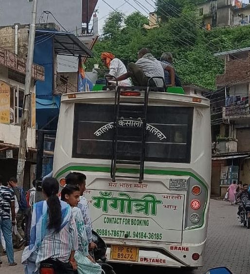 of buses on Parwanoo-Kasauli route

passengers being carried on rooftops
