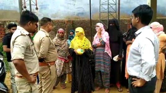 A woman poured petrol during a protest at the electricity office
