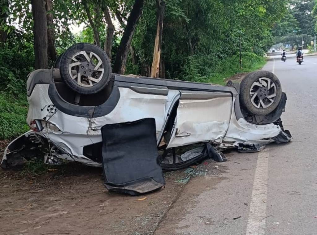 car tire burst, overturned after hitting a tree