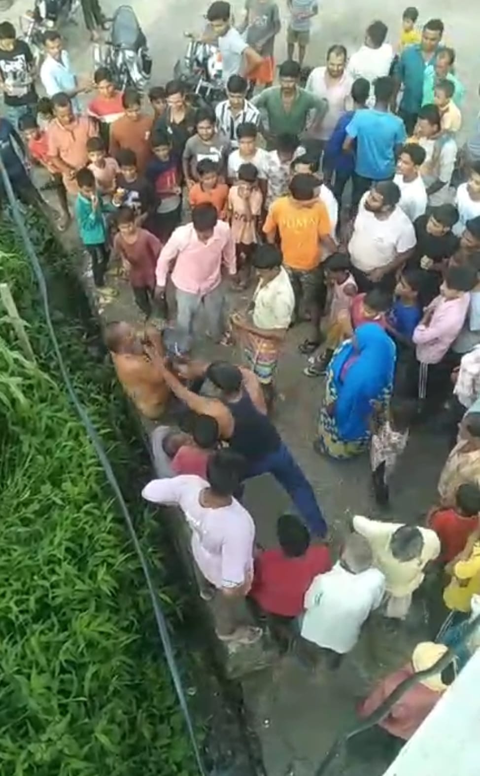 Half naked young man beaten for plucking ridge gourd, police station surrounded