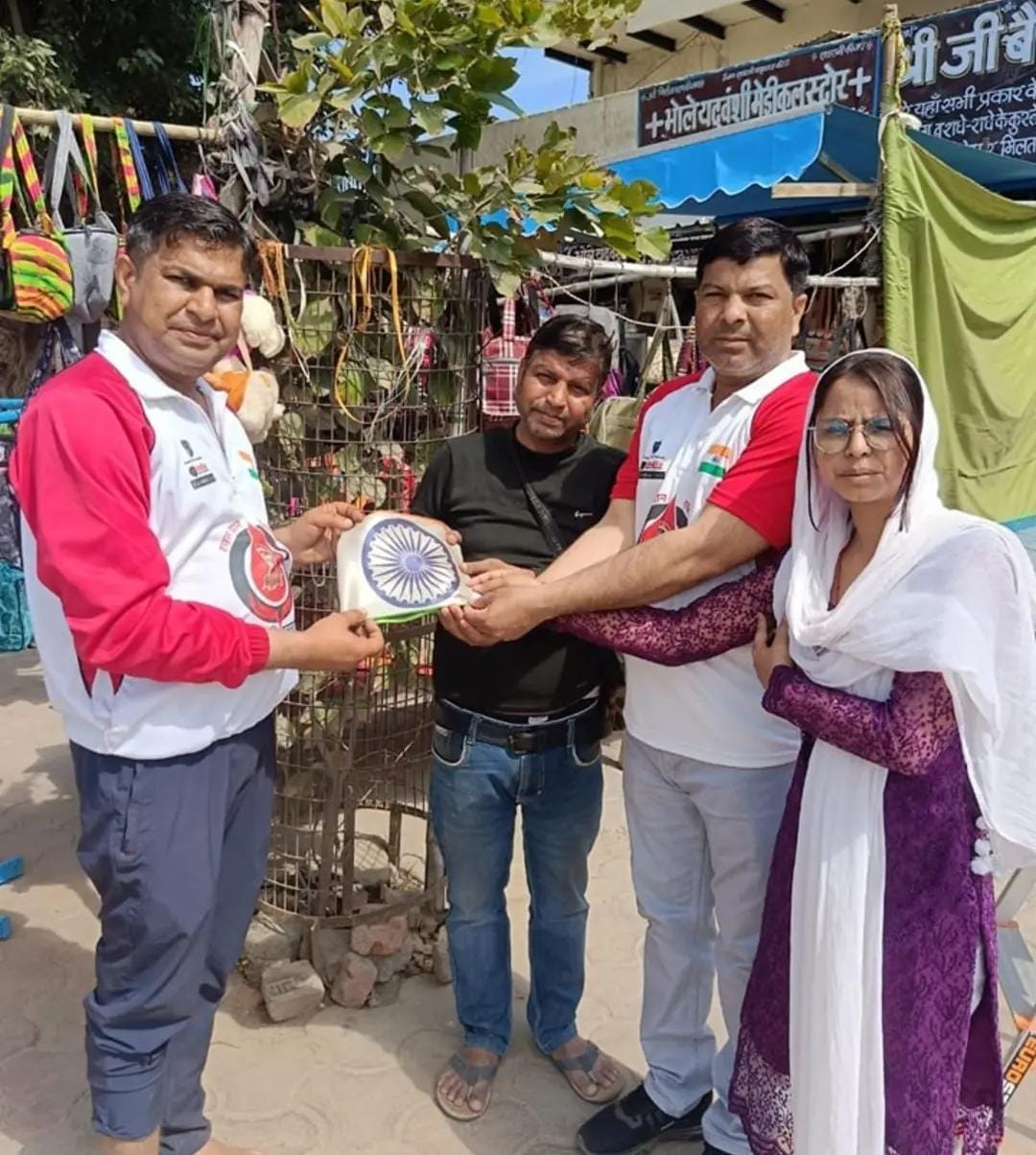 Members of Maa Bharati Raktavahini arrive to bring down the broken tricolor with respect