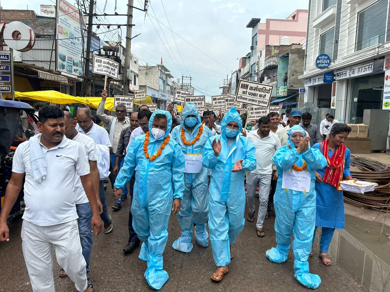 NHM workers came out to beg on the streets wearing PPE kits