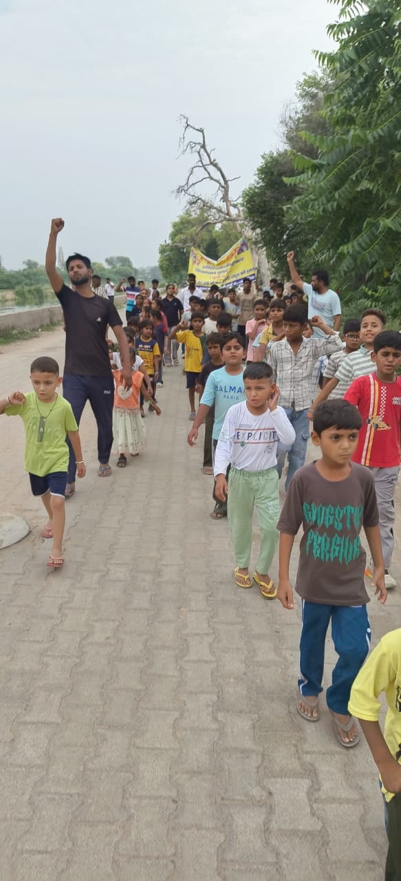 Children of Ramnagar Colony expressed their protest by march past and parade.