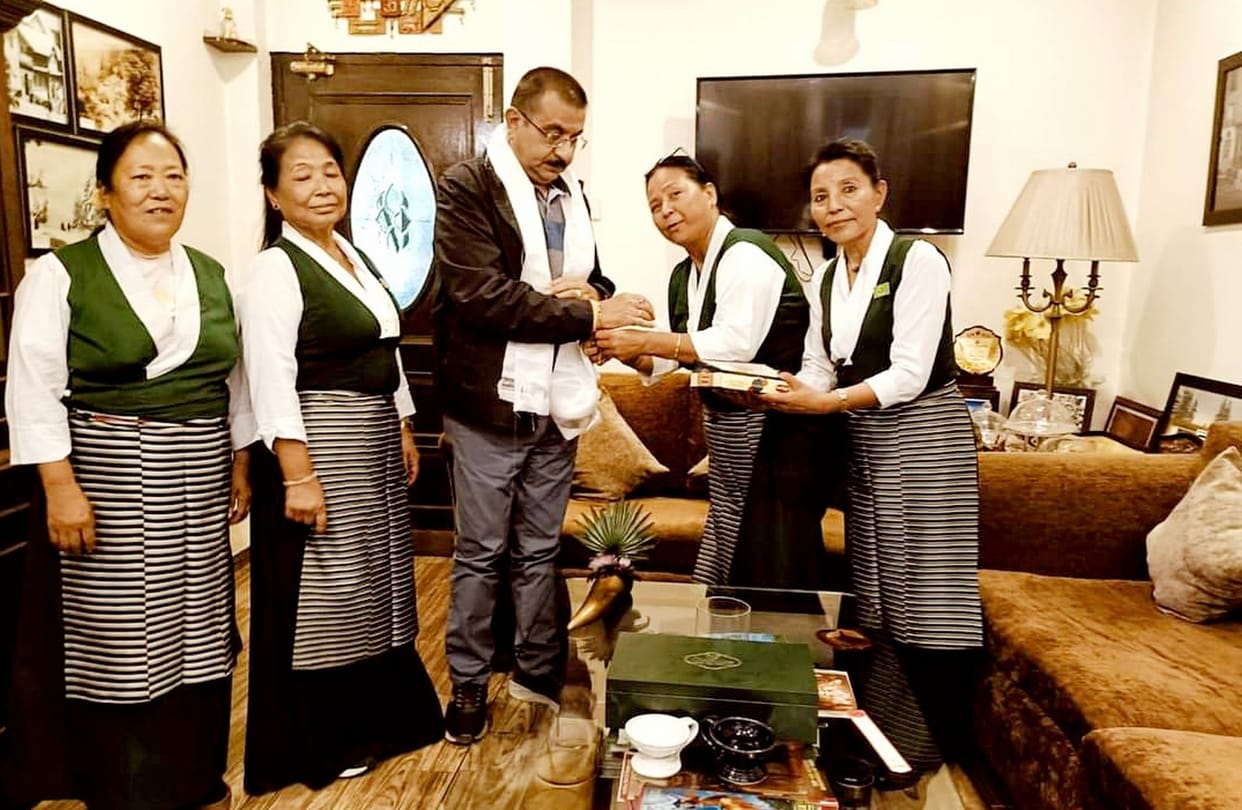 Tibetan women tied rakhi to former NP president