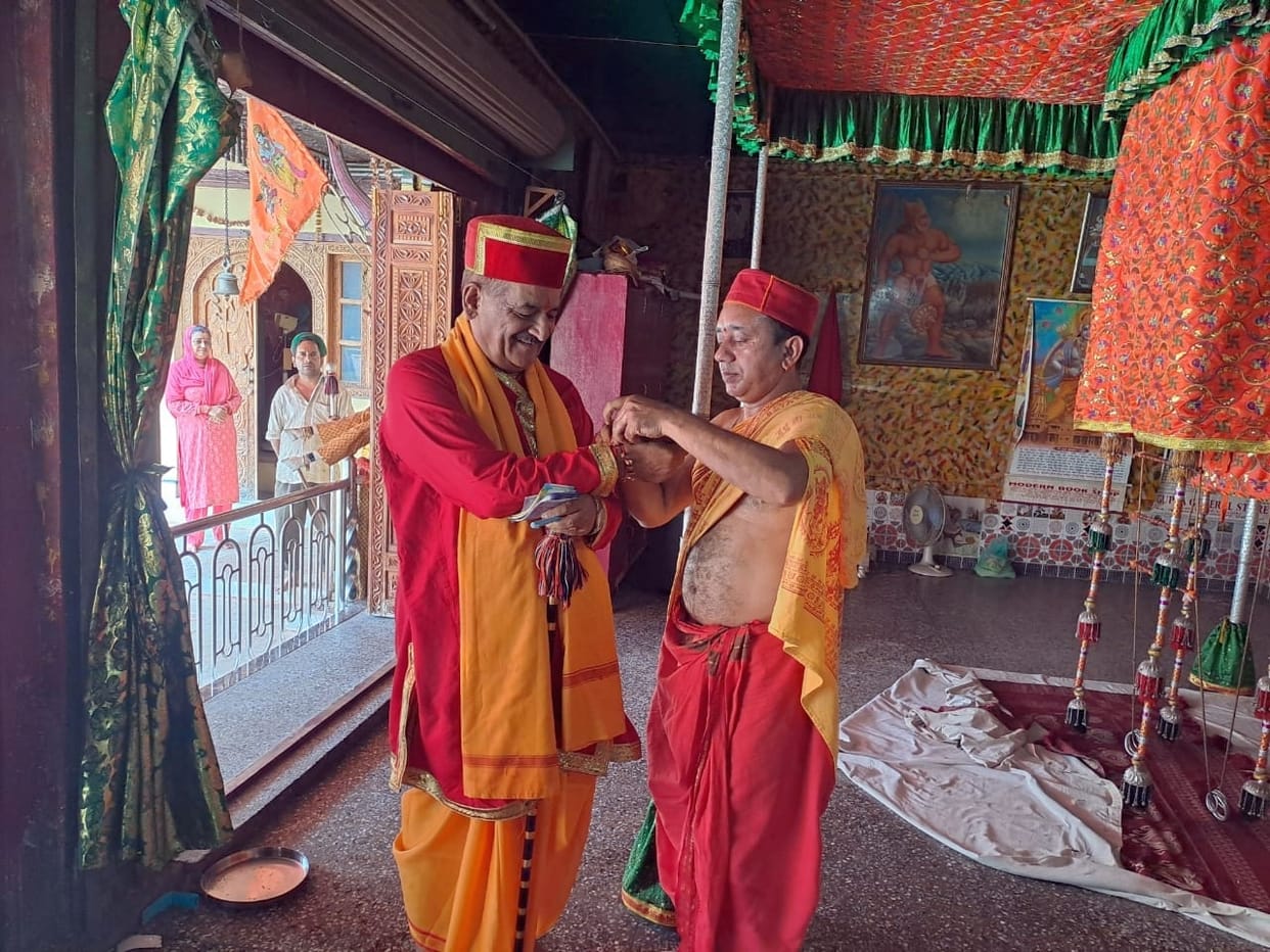 Sisters applied Tilak and tied Raksha Sutra on brother's wrist.