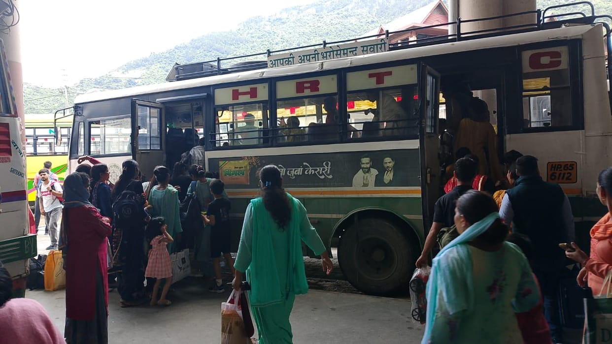 Corporation buses fell short in front of the crowd of women, they travelled standing