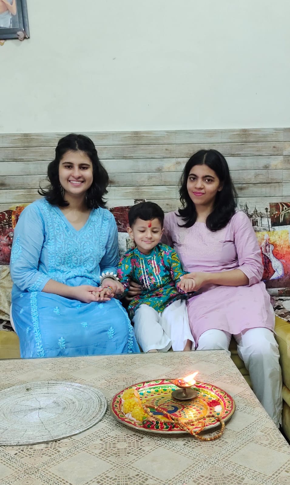 Sisters tie a thread of love on their brothers' wrists
