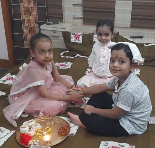 Sisters tie love on brother's wrist