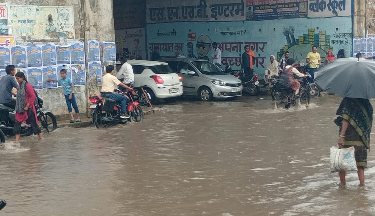 Rain gave relief from heat...service lane of highway filled with water